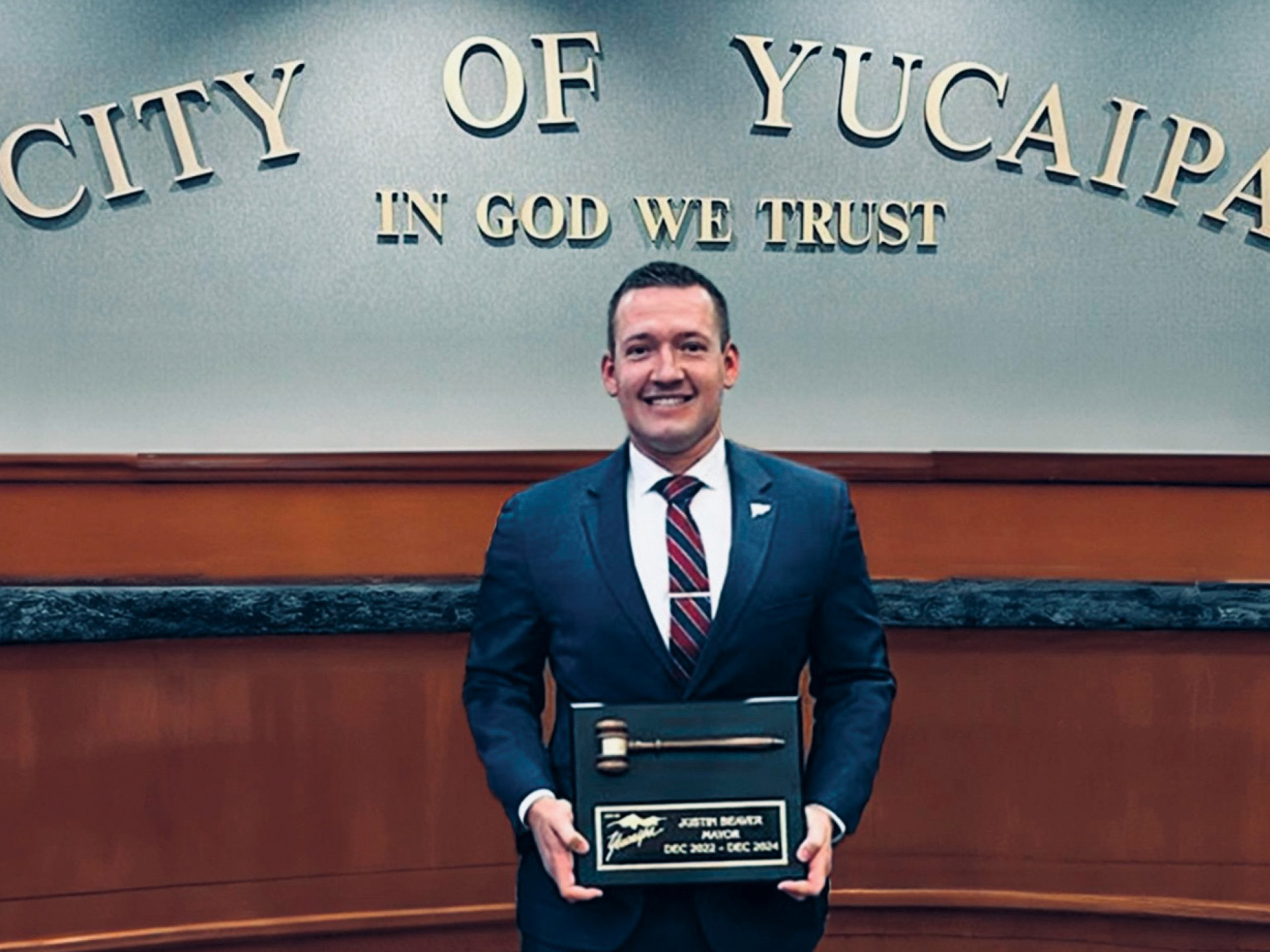 a-cop-on-the-council-1-Councilmember-Justin-Beaver-displays-a-plaque-commemorating-his-service-as-mayor-of-Yucaipa-in-2023-and-2024