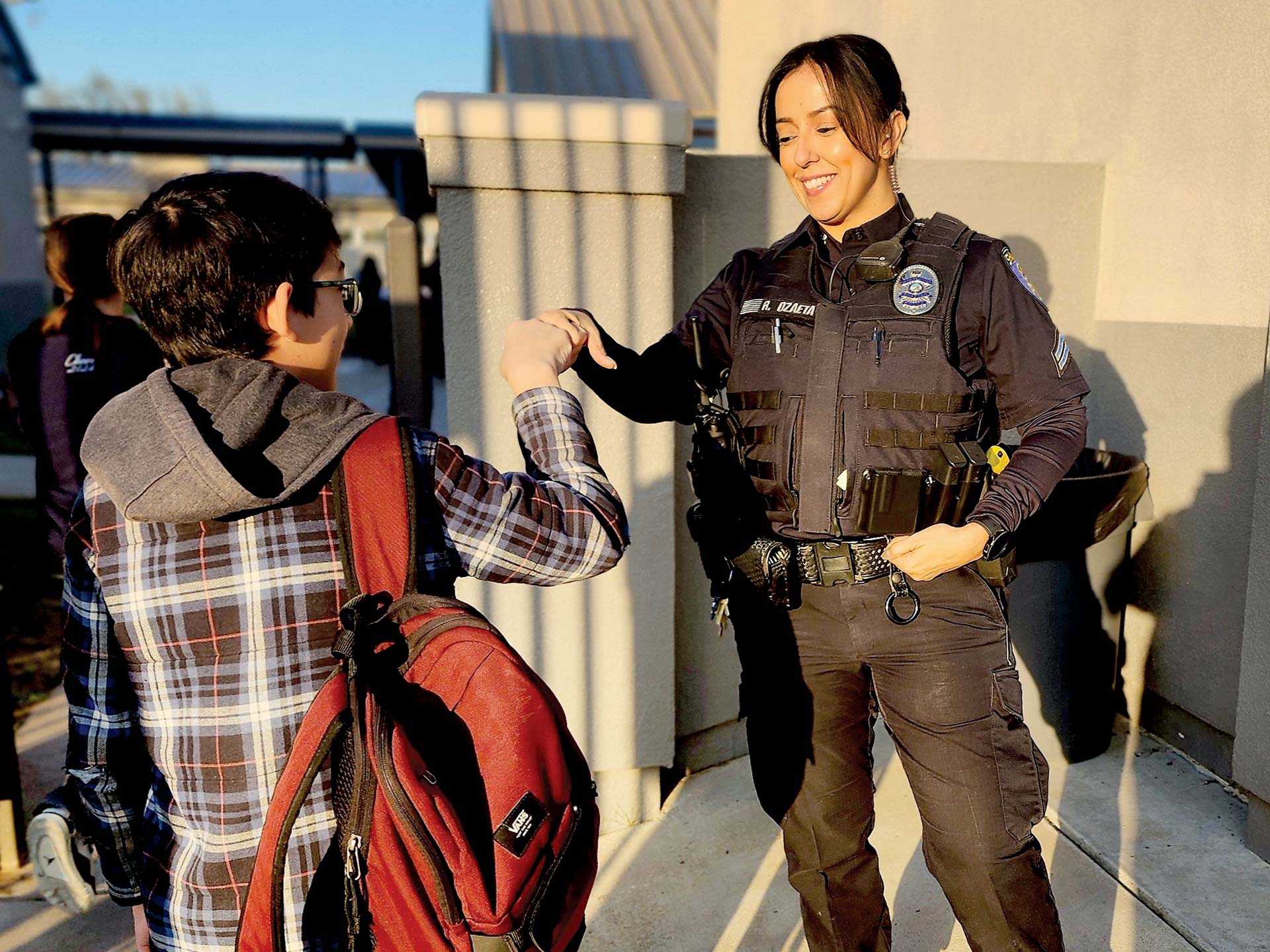 feature-a-salute-to-school-resource-officers-4-Ozaeta-offers-a-friendly-presence-as-kids-arrive-at-school-each-day.