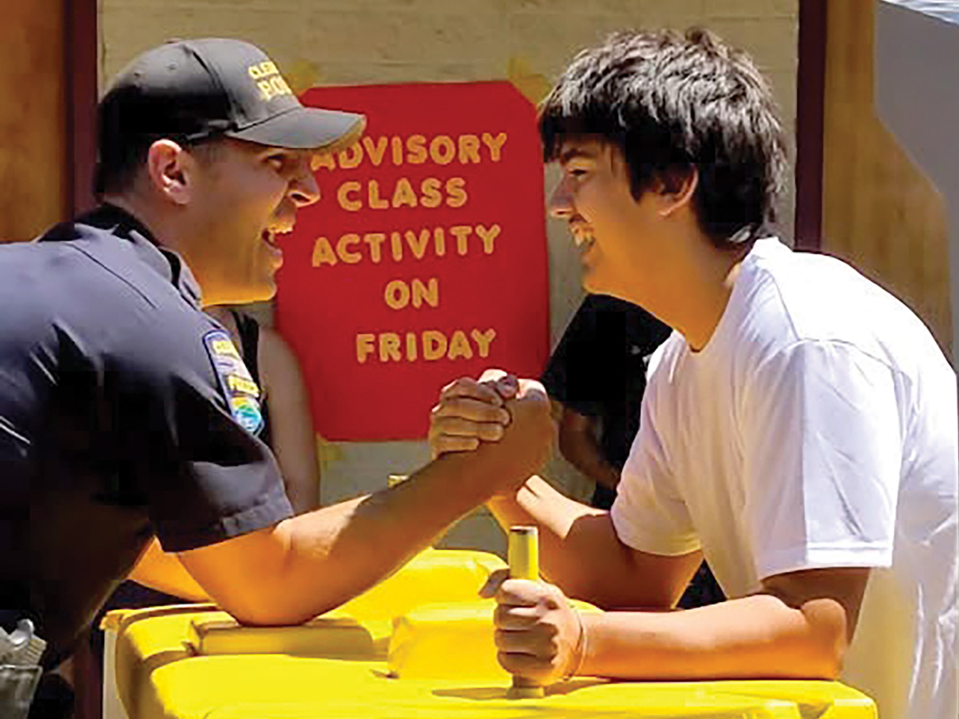 feature-a-salute-to-school-resource-officers-6-Perry-taking-part-in-a-friendly-arm-wrestling-match