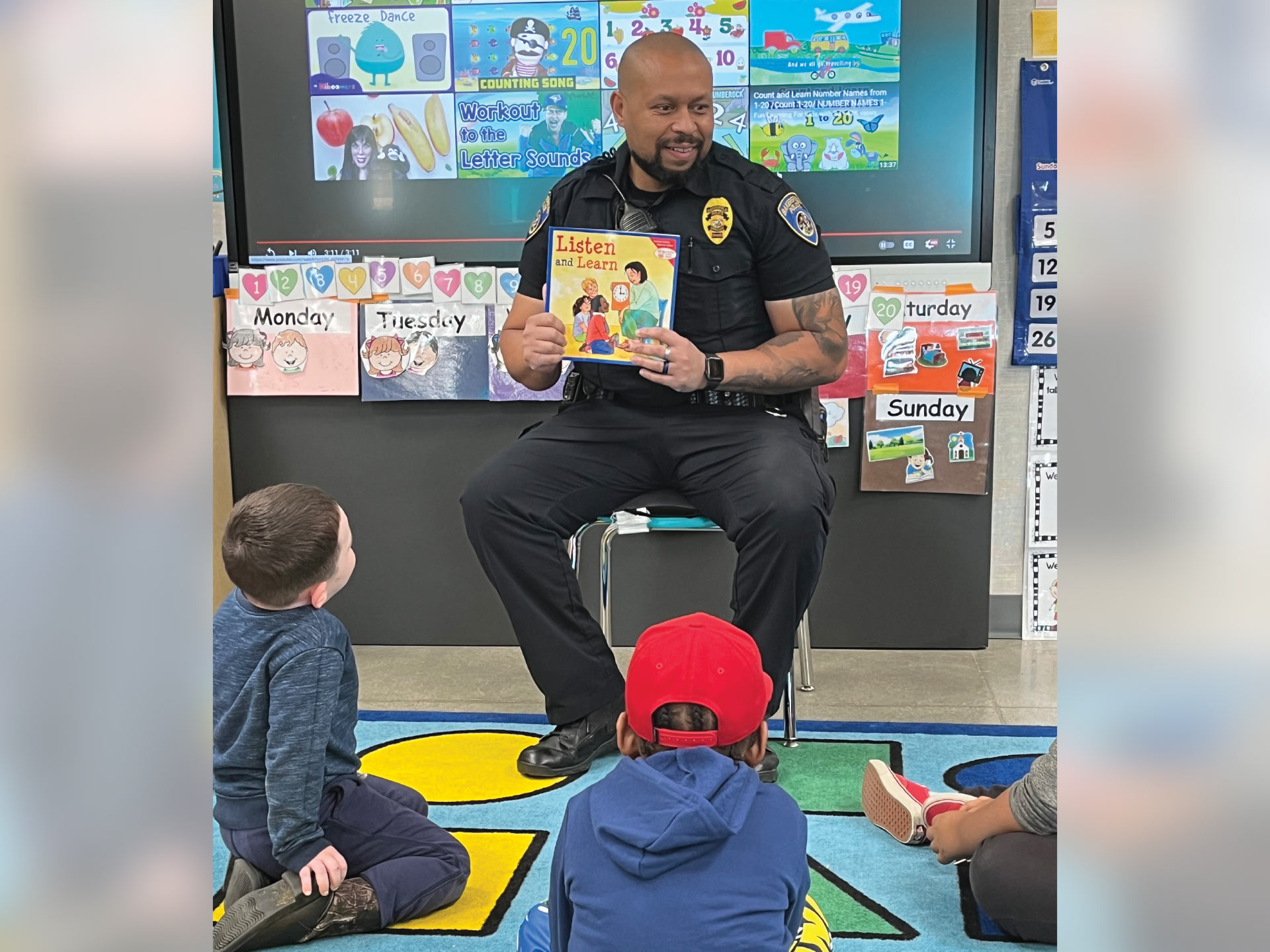 feature-a-salute-to-school-resource-officers-7-Serving-as-a-celebrity-reader-in-classrooms-is-one-of-Bakersfield-Police-Officer-Charles-Pratts-SRO-duties